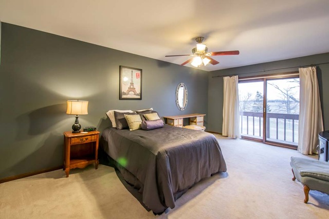 50W663 Ramm Road Maple Park, IL 60151 - Photo 16 of 25 a bedroom with a bed and a chandelier
