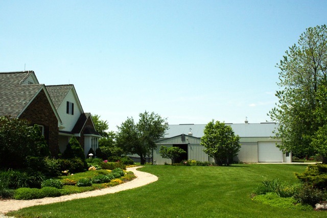 50W663 Ramm Road Maple Park, IL 60151 - Photo 2 of 25 a view of a house with a backyard and a garden