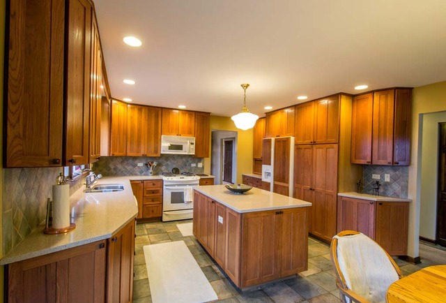 50W663 Ramm Road Maple Park, IL 60151 - Photo 5 of 25 a kitchen with a sink stove and cabinets