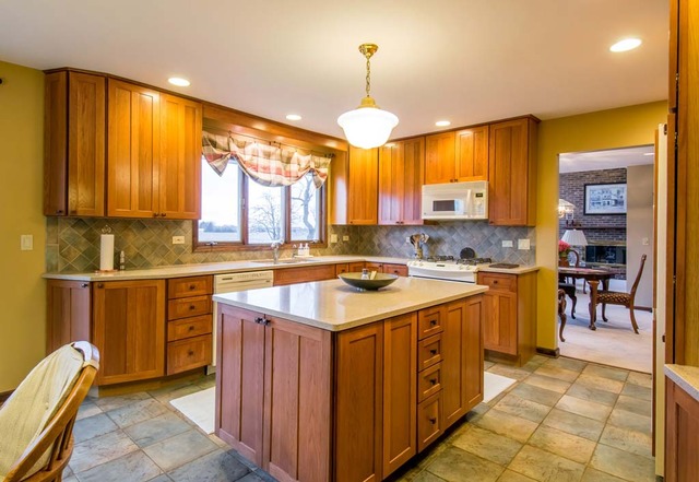 50W663 Ramm Road Maple Park, IL 60151 - Photo 6 of 25 a kitchen with a sink stove and cabinets