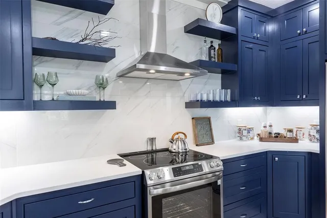 a kitchen with stainless steel appliances granite countertop a sink and wooden cabinets