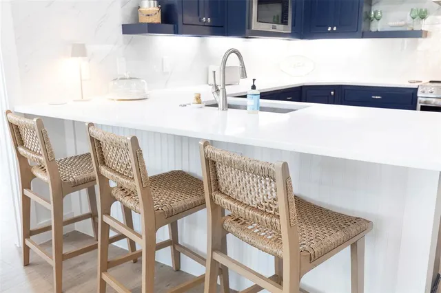 a kitchen with a table and chairs