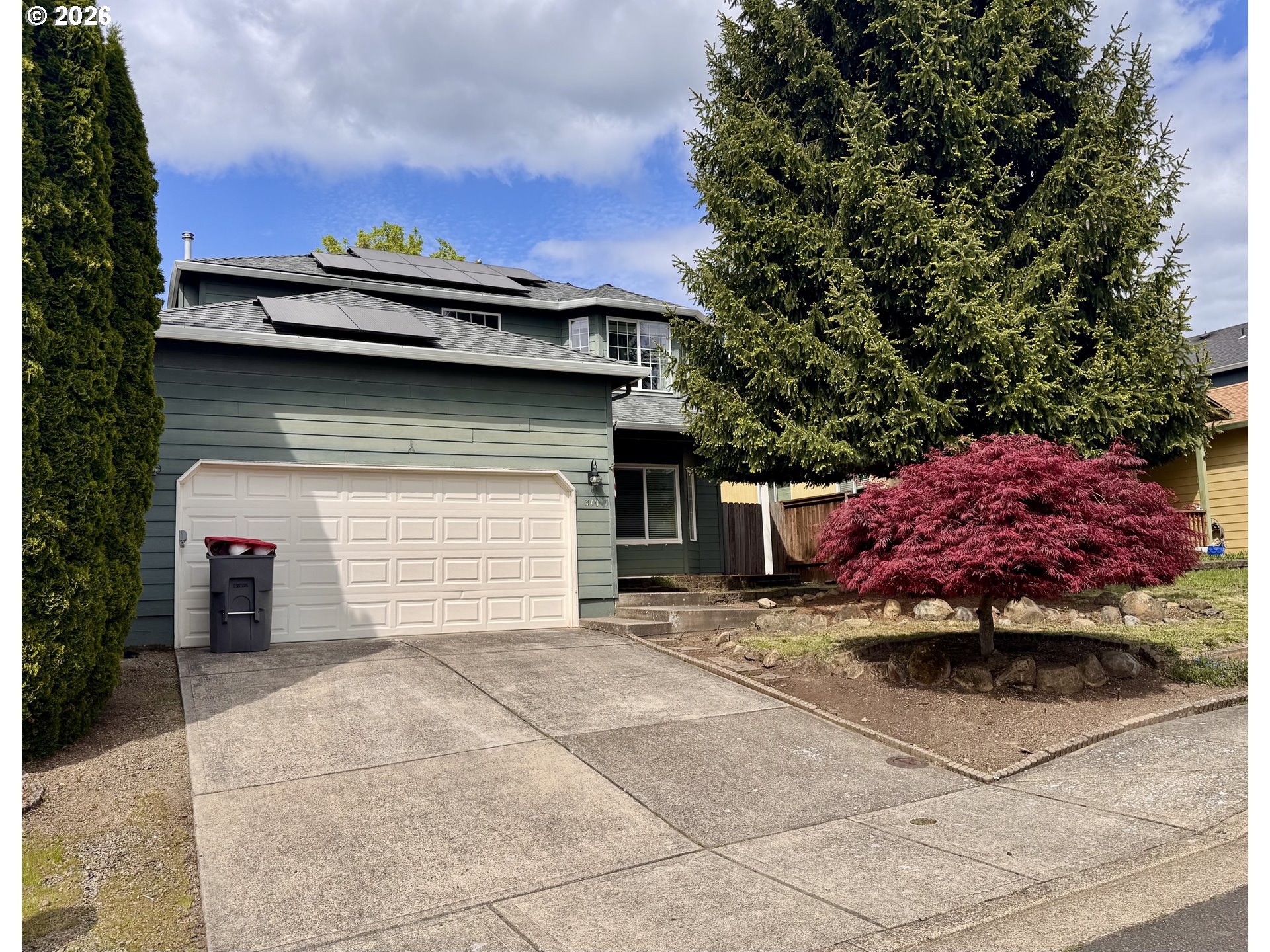 310 13th Street Lafayette, OR 97127 - Photo 1 of 22 a view of a house with a garage