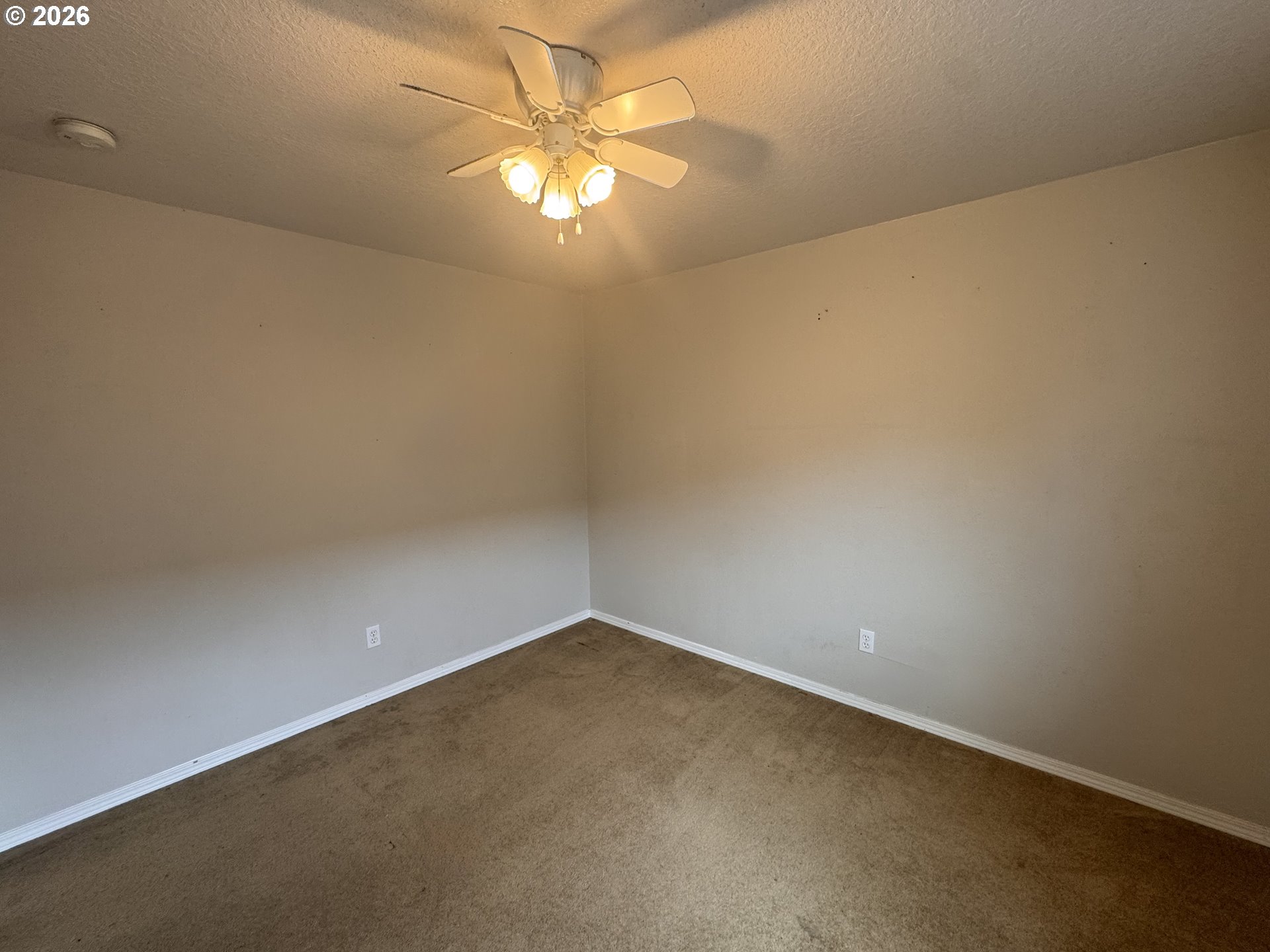 310 13th Street Lafayette, OR 97127 - Photo 12 of 22 an empty room with a fan & a window