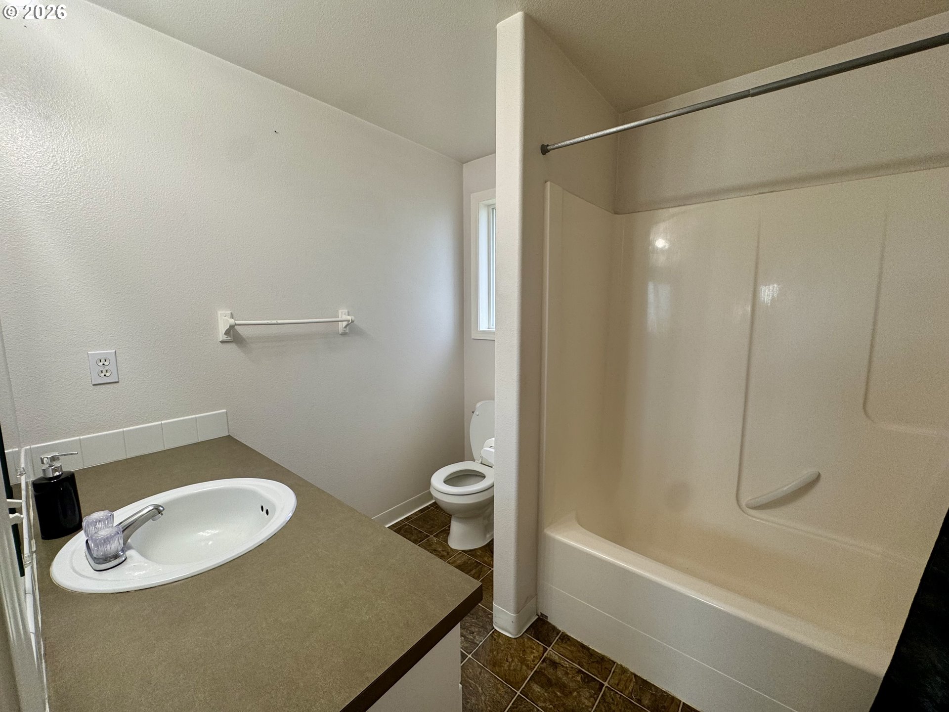 310 13th Street Lafayette, OR 97127 - Photo 14 of 22 a bathroom with a shower a toilet and a sink