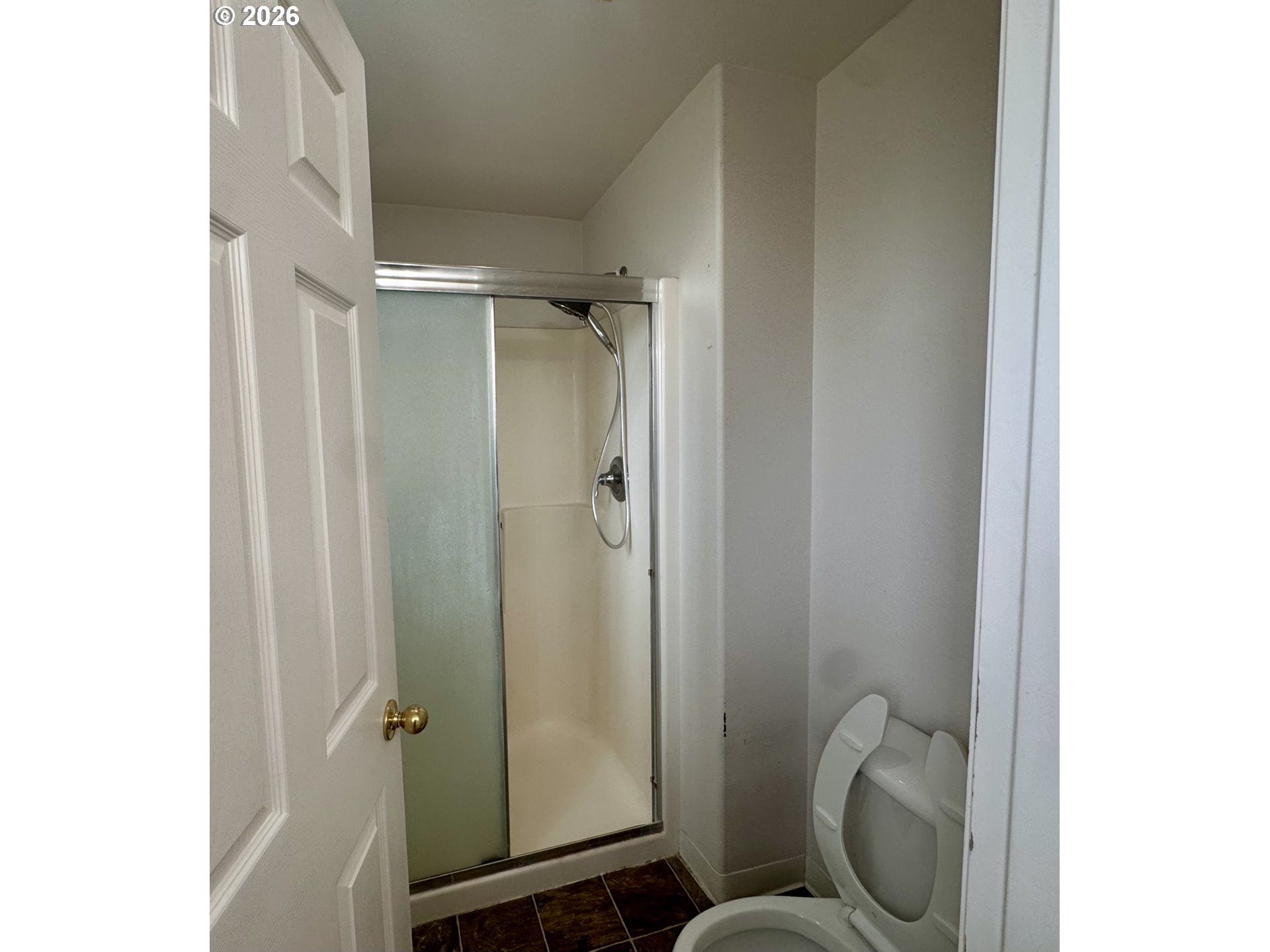 310 13th Street Lafayette, OR 97127 - Photo 16 of 22 a bathroom with a granite countertop toilet and a shower