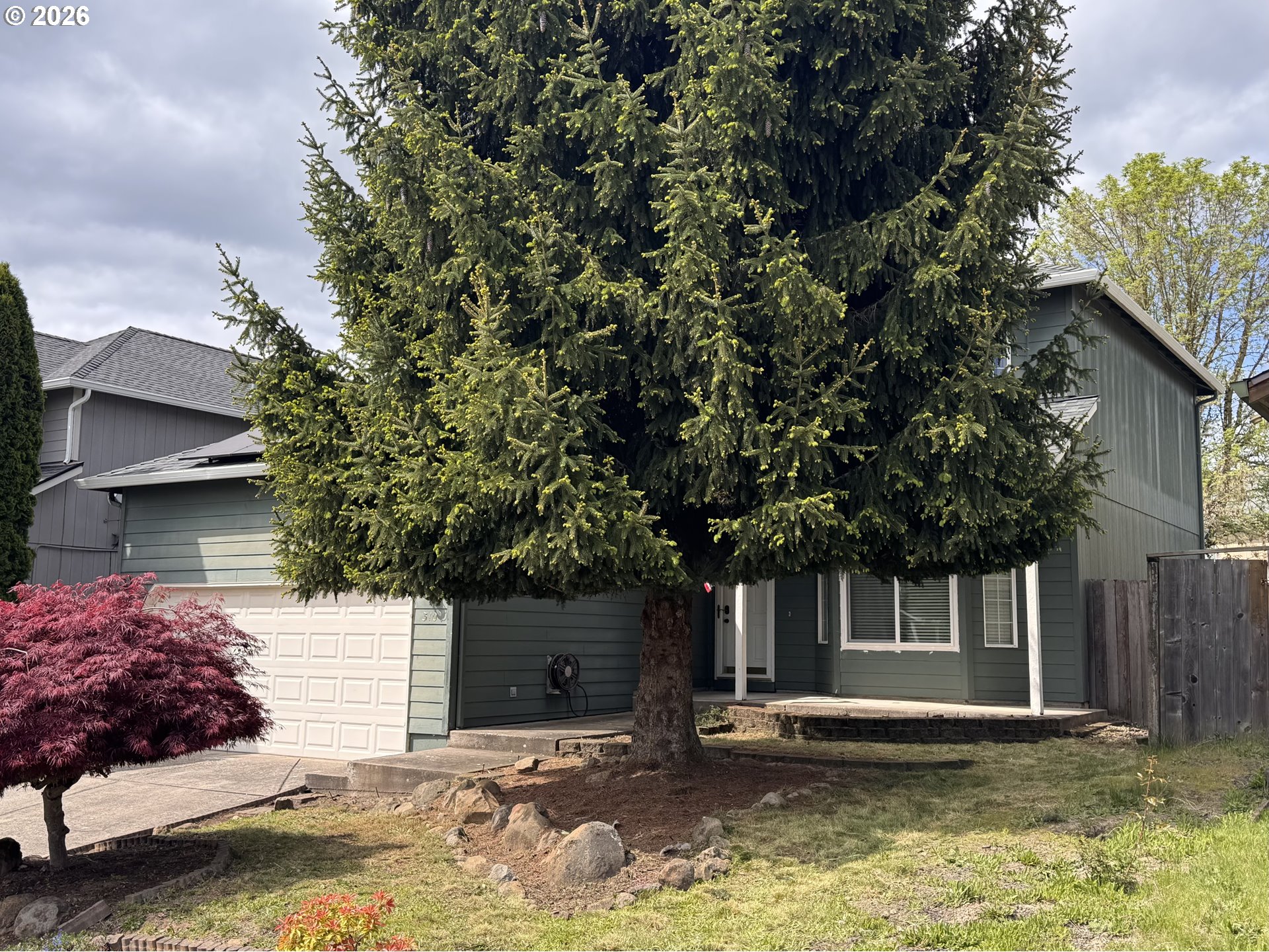 310 13th Street Lafayette, OR 97127 - Photo 3 of 22 a view of a house with a yard garage and a chair