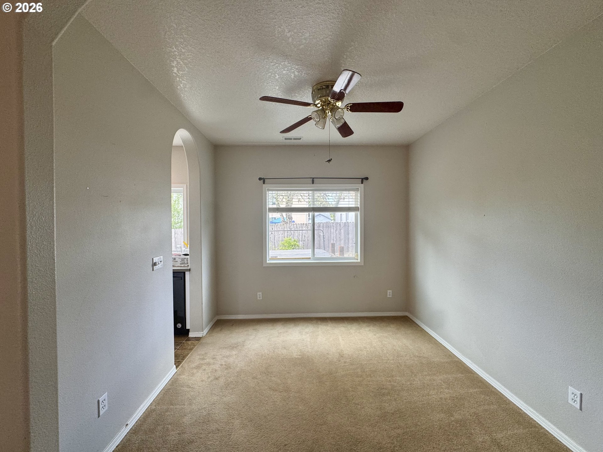 310 13th Street Lafayette, OR 97127 - Photo 6 of 22 a view of room with a ceiling fan and window