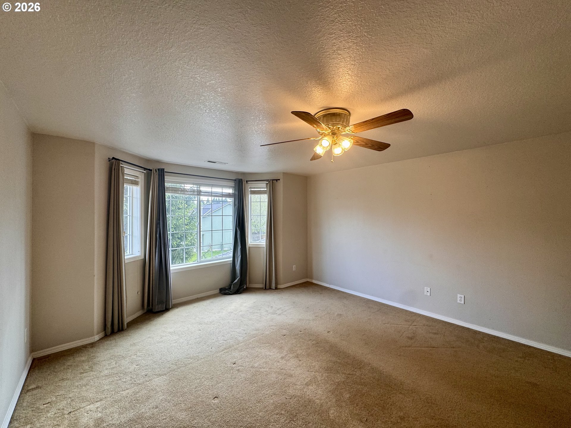 310 13th Street Lafayette, OR 97127 - Photo 9 of 22 a view of an empty room with a window