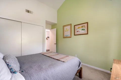 a bathroom with a granite countertop sink a toilet and a shower