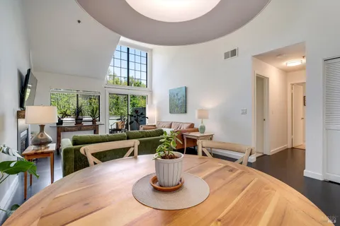 a dining room with table and chairs