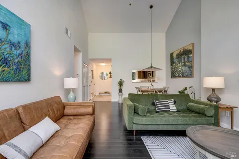 a living room with furniture and a lamp