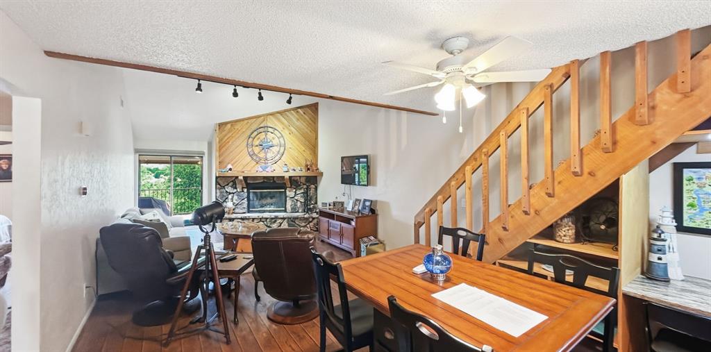 3037 Hells Gate Loop, Unit C208 Strawn, TX 76475 - Photo 13 of 24 a view of a dining room with furniture window and wooden floor