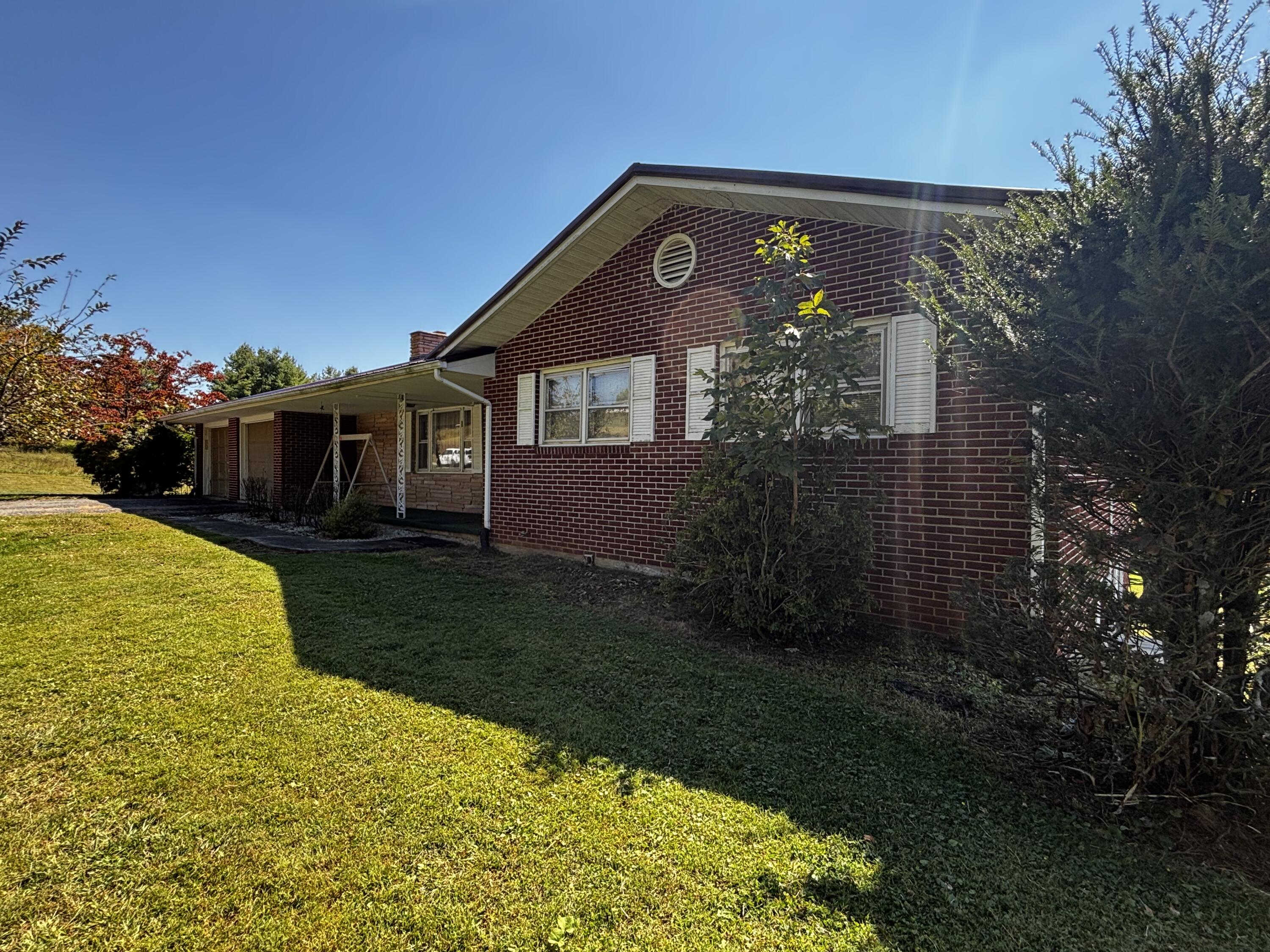 a front view of house along with garden