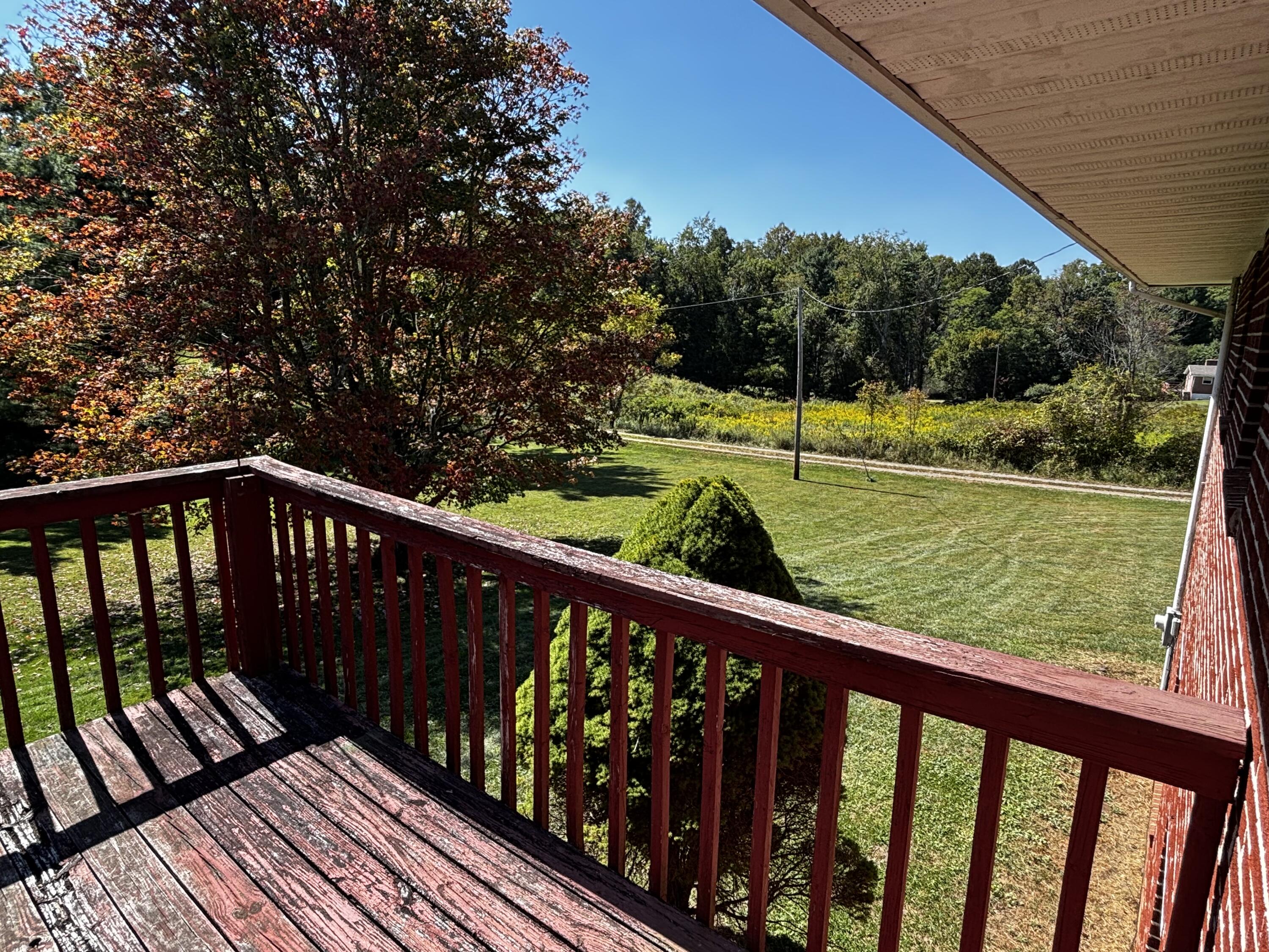 375 Barberry Road Southeast Floyd, VA 24091 - Photo 14 of 40 a view of balcony with wooden floor and fence