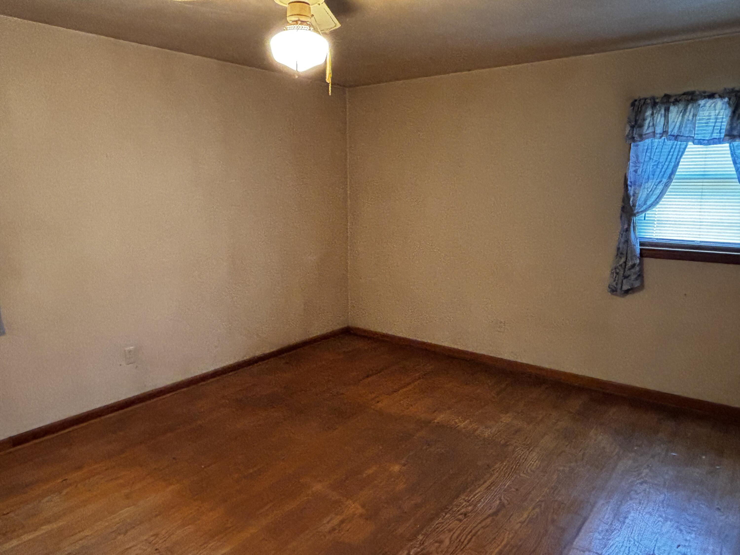 375 Barberry Road Southeast Floyd, VA 24091 - Photo 26 of 40 a view of an empty room with wooden floor and a window