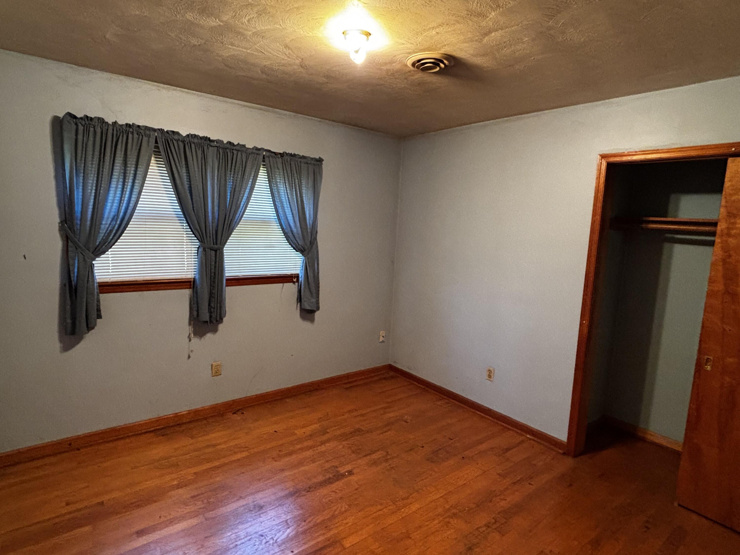 375 Barberry Road Southeast Floyd, VA 24091 - Photo 30 of 40 an empty room with wooden floor and window
