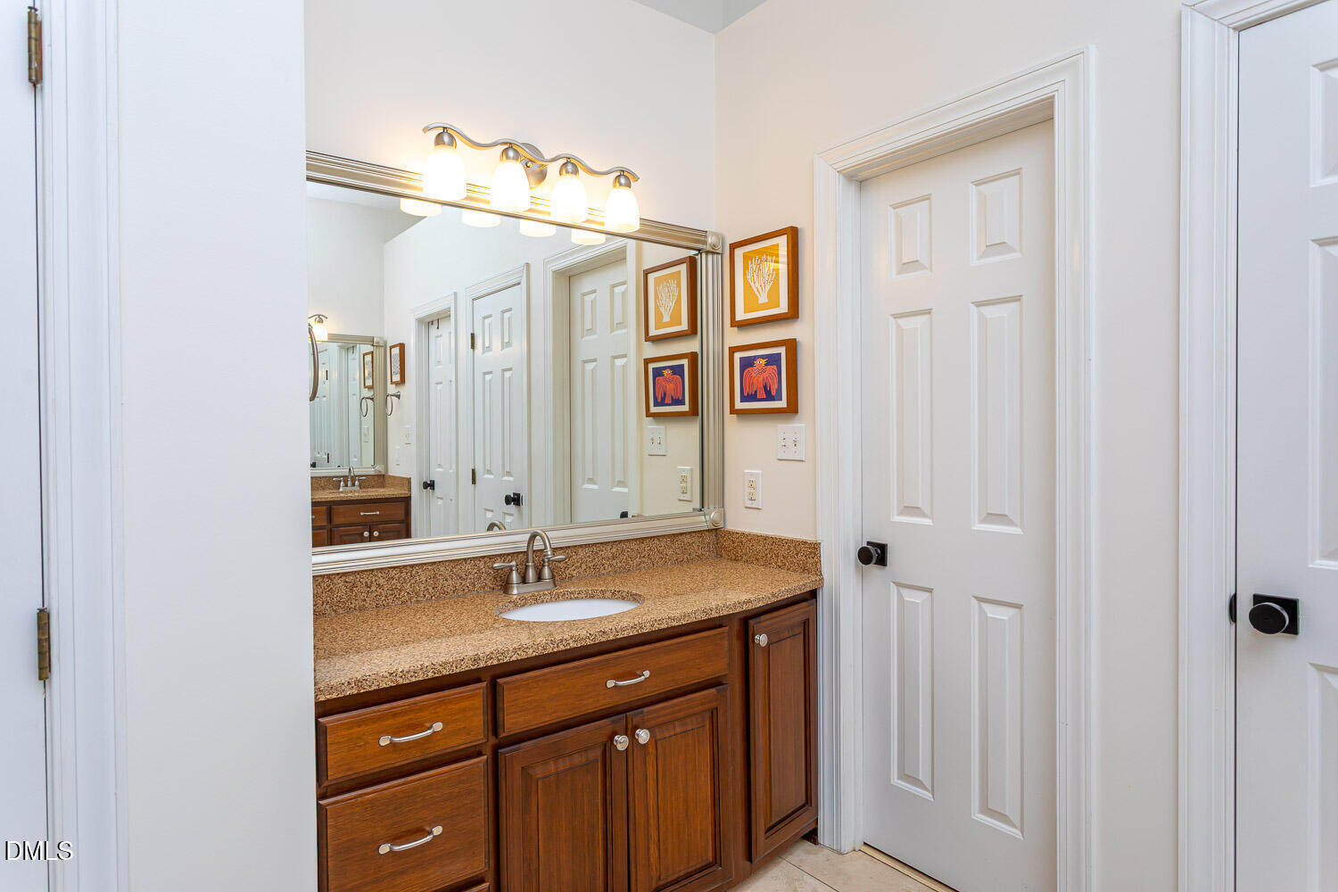 8509 Towneley Place Raleigh, NC 27615 - Photo 19 of 36 a bathroom with a sink vanity and mirror