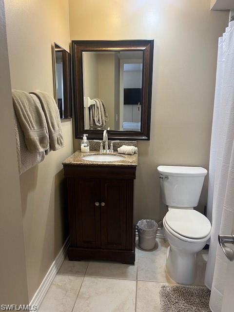 800 Meadowland Drive, Unit 252 Naples, FL 34108 - Photo 12 of 21 a bathroom with a toilet sink and mirror