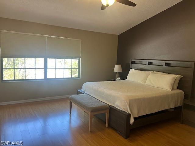 800 Meadowland Drive, Unit 252 Naples, FL 34108 - Photo 16 of 21 a bed sitting in a bedroom next to a window