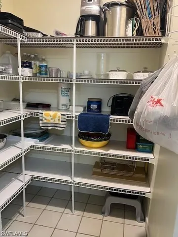 a roof deck with a table and chairs