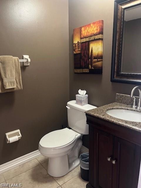 800 Meadowland Drive, Unit 252 Naples, FL 34108 - Photo 10 of 21 a bathroom with a granite countertop toilet sink and mirror