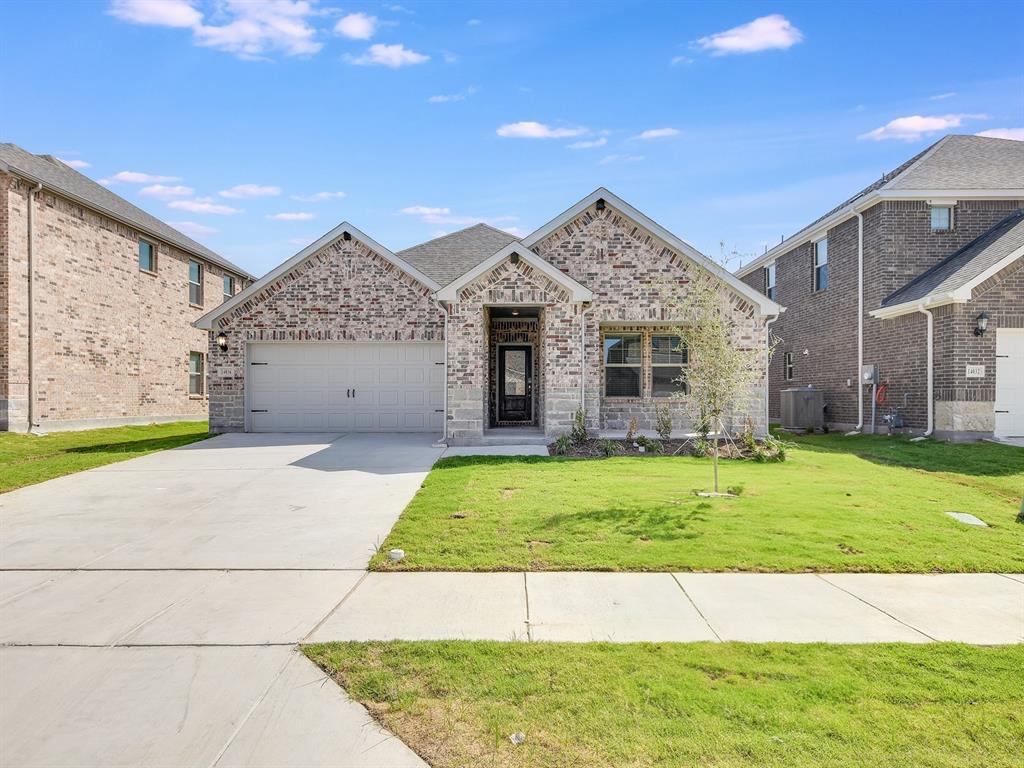14036 Callisto Way Haslet, TX 76052 - Photo 1 of 1 a front view of a house with a garden and yard