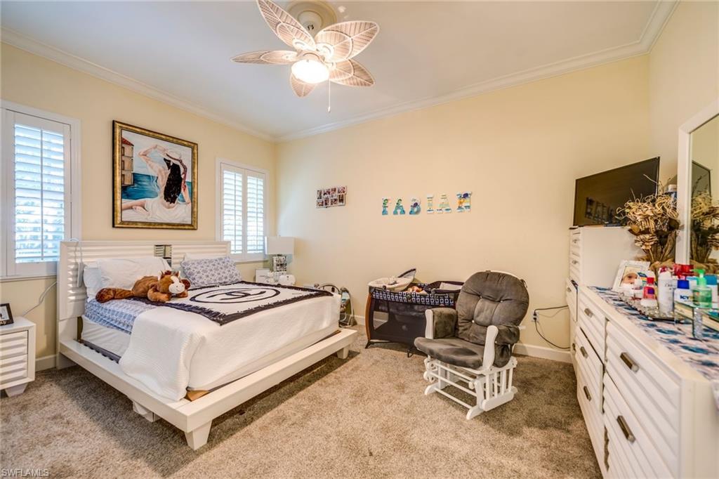 1672 Jewel Naples, FL 34102 - Photo 13 of 27 a living room with furniture and a flat screen tv