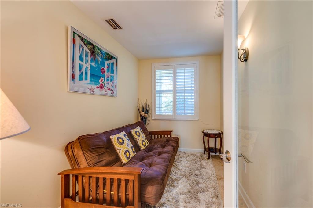 1672 Jewel Naples, FL 34102 - Photo 18 of 27 a living room with furniture and a window