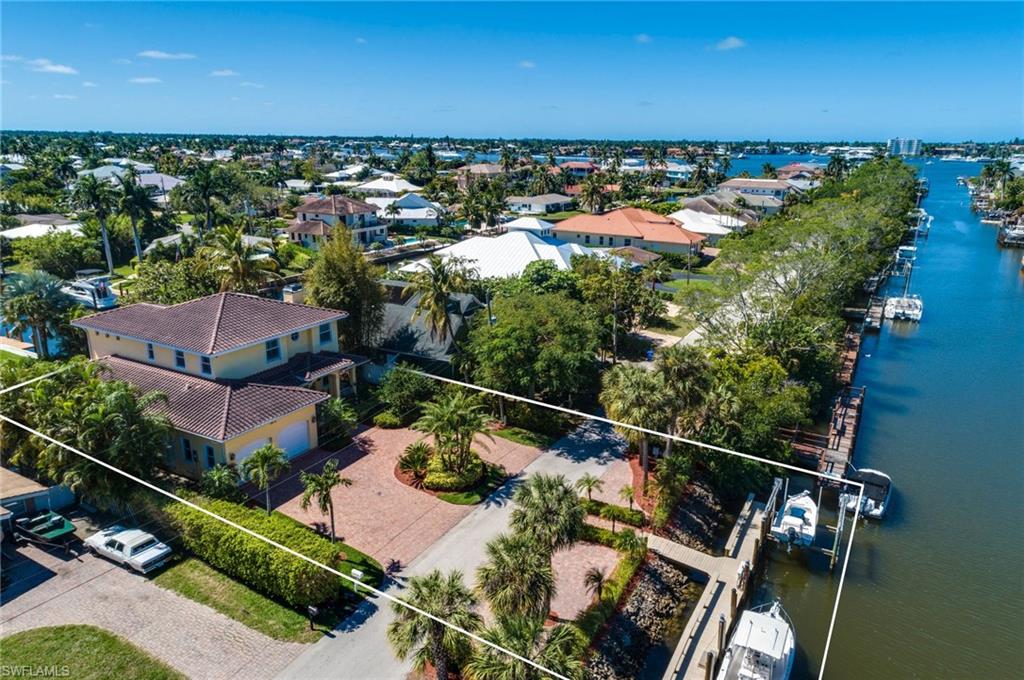1672 Jewel Naples, FL 34102 - Photo 2 of 27 a view of a lake with a garden