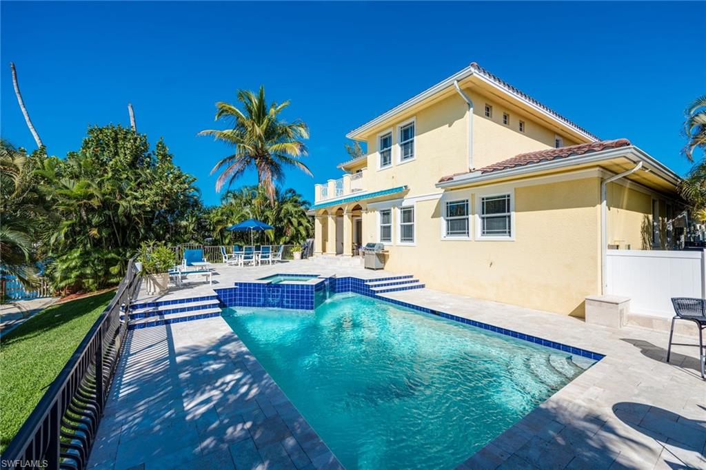 1672 Jewel Naples, FL 34102 - Photo 21 of 27 a front view of house with yard and outdoor seating