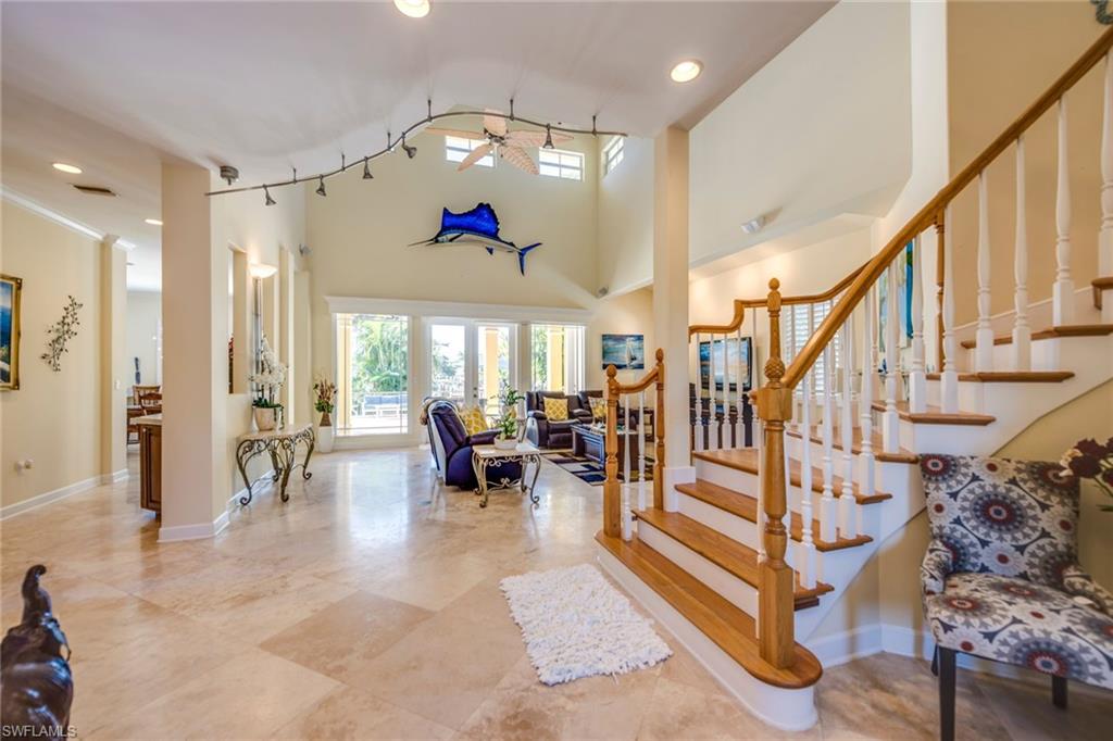 1672 Jewel Naples, FL 34102 - Photo 4 of 27 a living room with lots of furniture and a large window