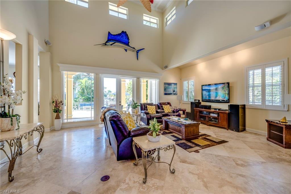 1672 Jewel Naples, FL 34102 - Photo 5 of 27 a living room with furniture and a flat screen tv
