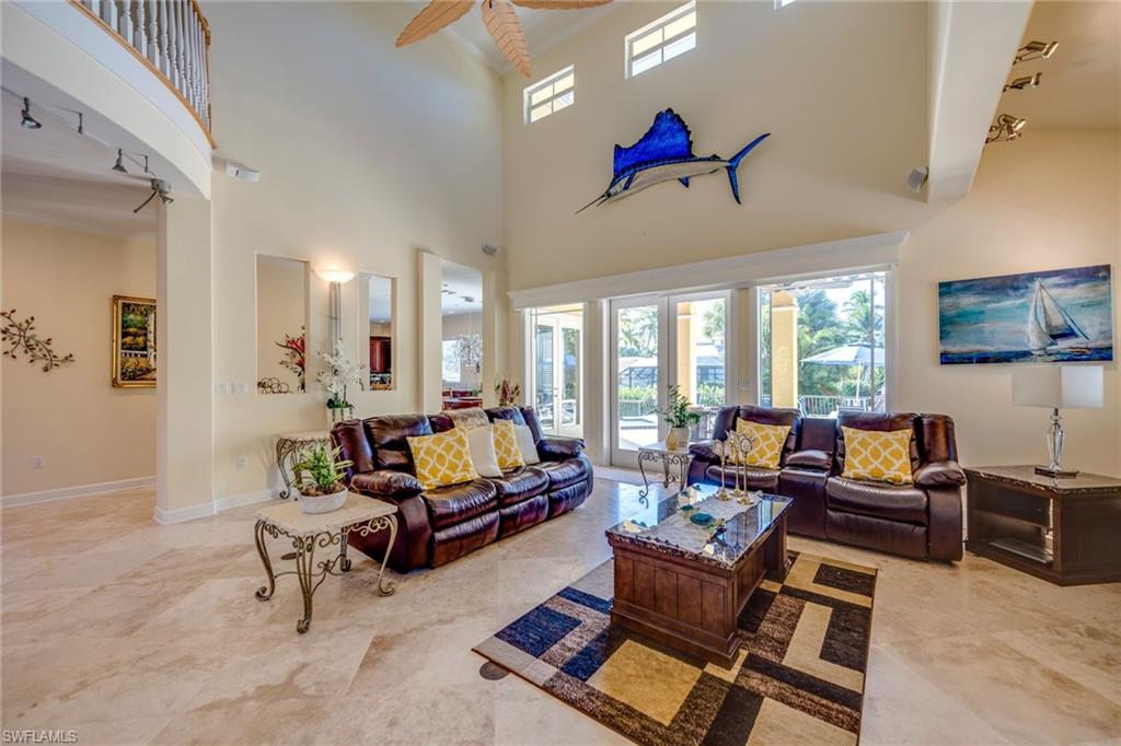 1672 Jewel Naples, FL 34102 - Photo 6 of 27 a living room with furniture and a large window