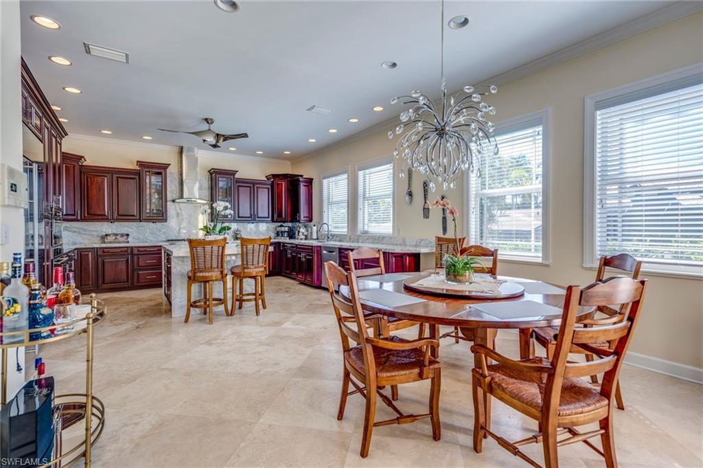 1672 Jewel Naples, FL 34102 - Photo 8 of 27 a view of a dining room with furniture and a chandelier