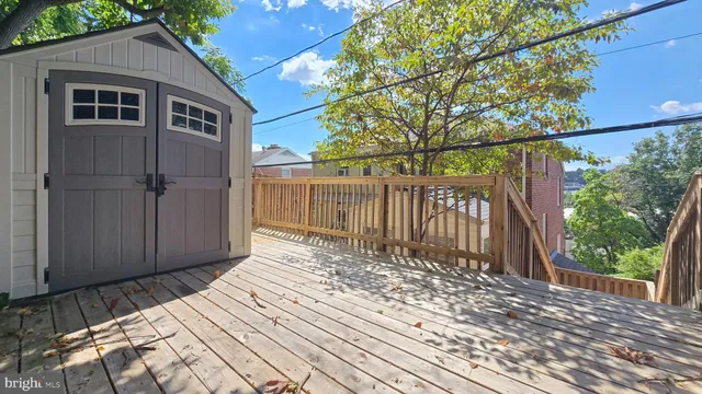 a view of wooden fence and trees
