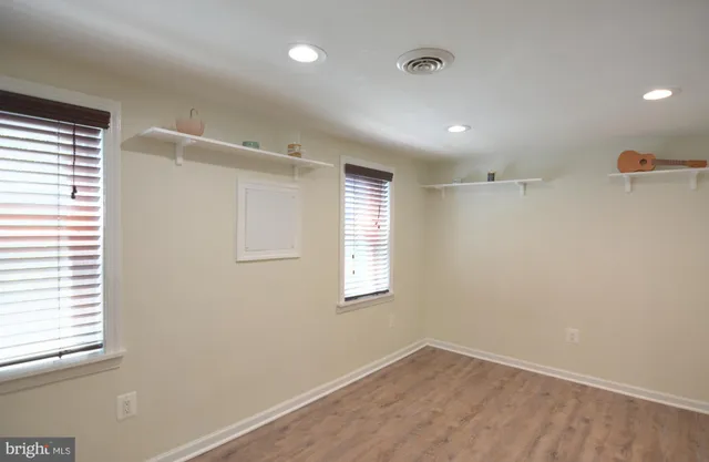a white bath tub sitting next to a white sink