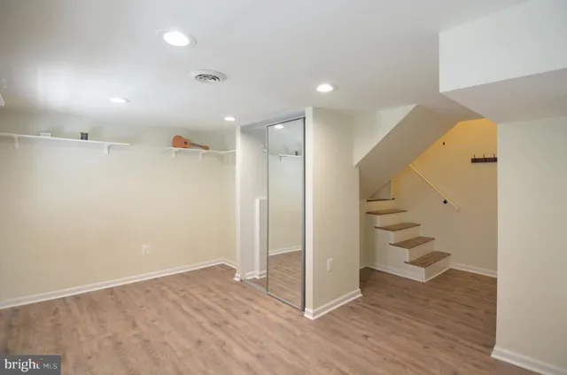 a bathroom with a sink toilet and mirror
