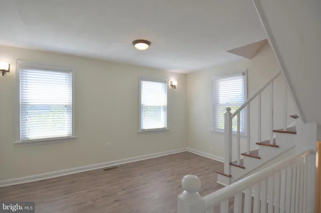 a view of a kitchen with a sink and cabinets