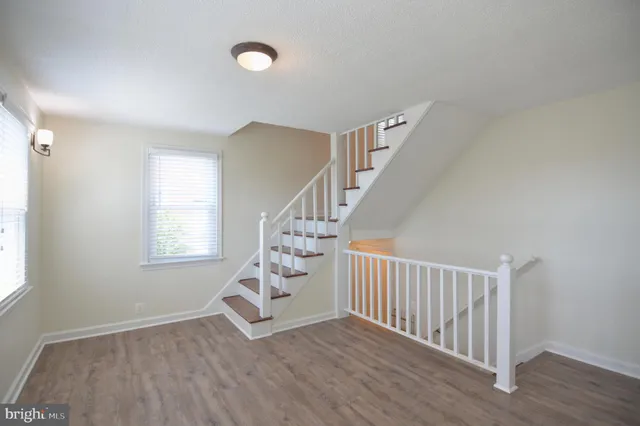 a kitchen with a refrigerator and a stove