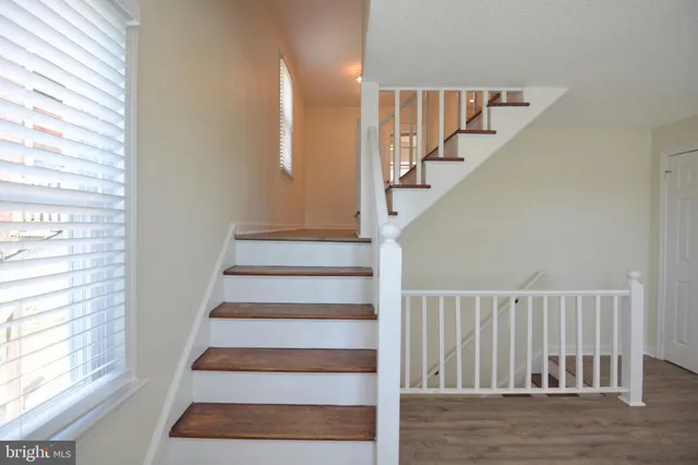a kitchen with a stove a sink and a microwave