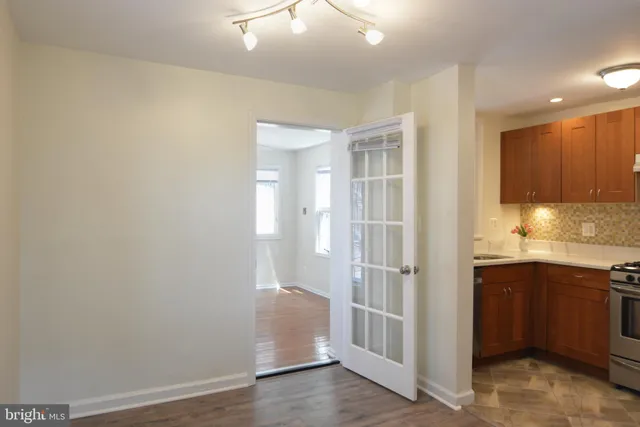 a kitchen with a sink and a stove