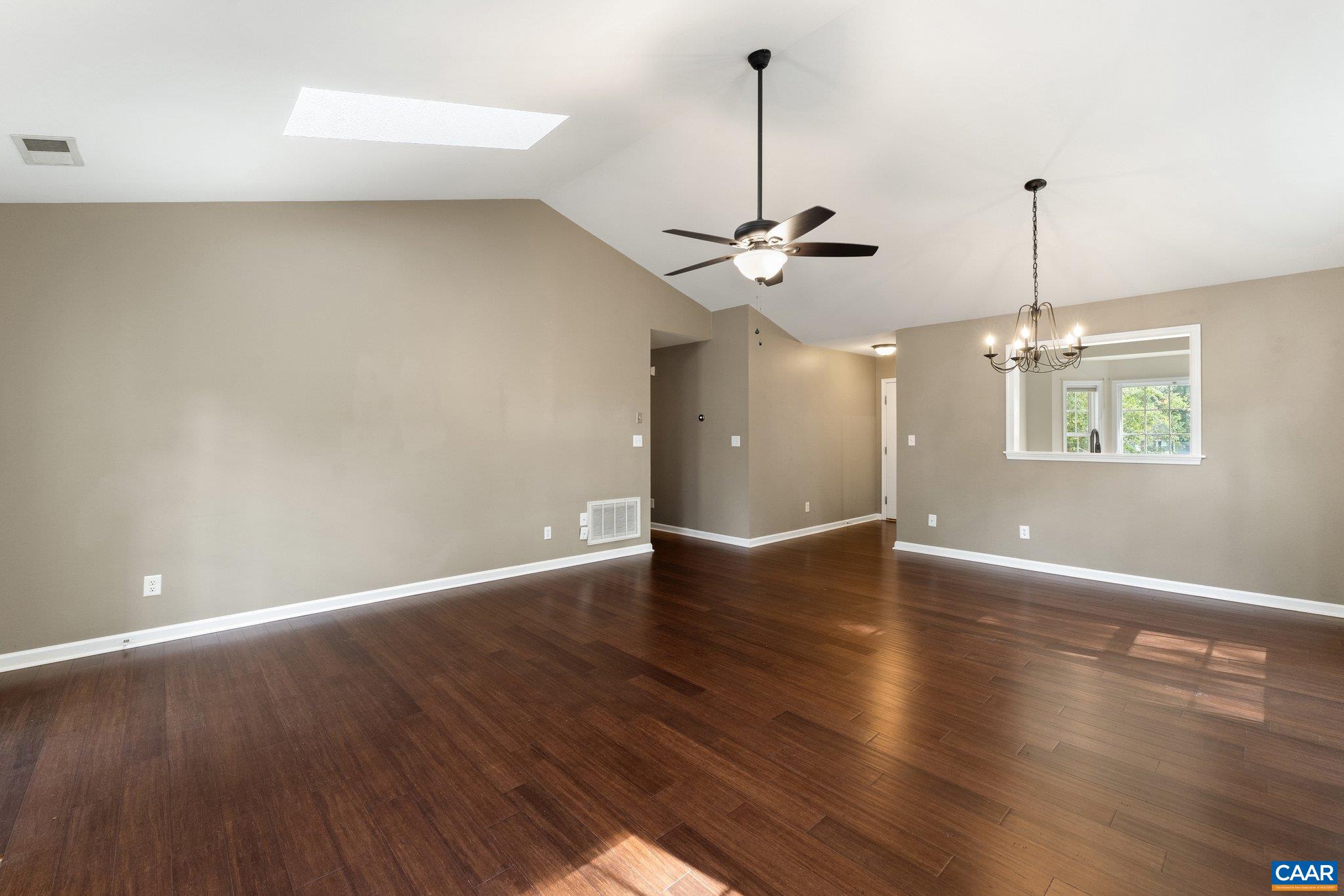 507 Northridge Road Ruckersville, VA 22968 - Photo 25 of 48 a view of an empty room with wooden floor and windows