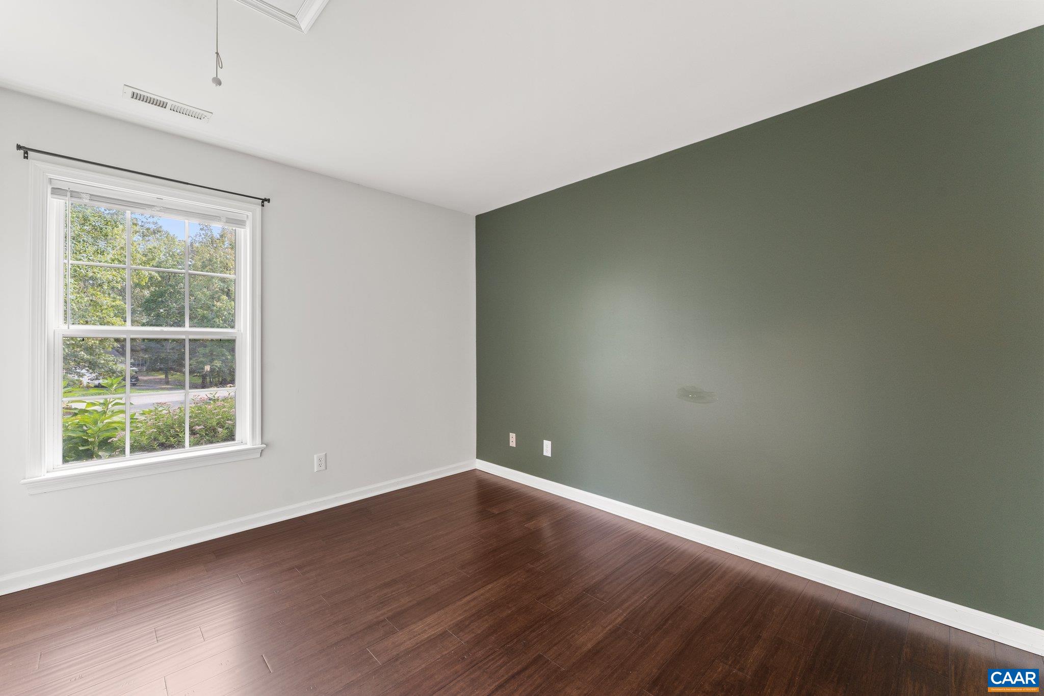 507 Northridge Road Ruckersville, VA 22968 - Photo 28 of 48 an empty room with wooden floor and windows