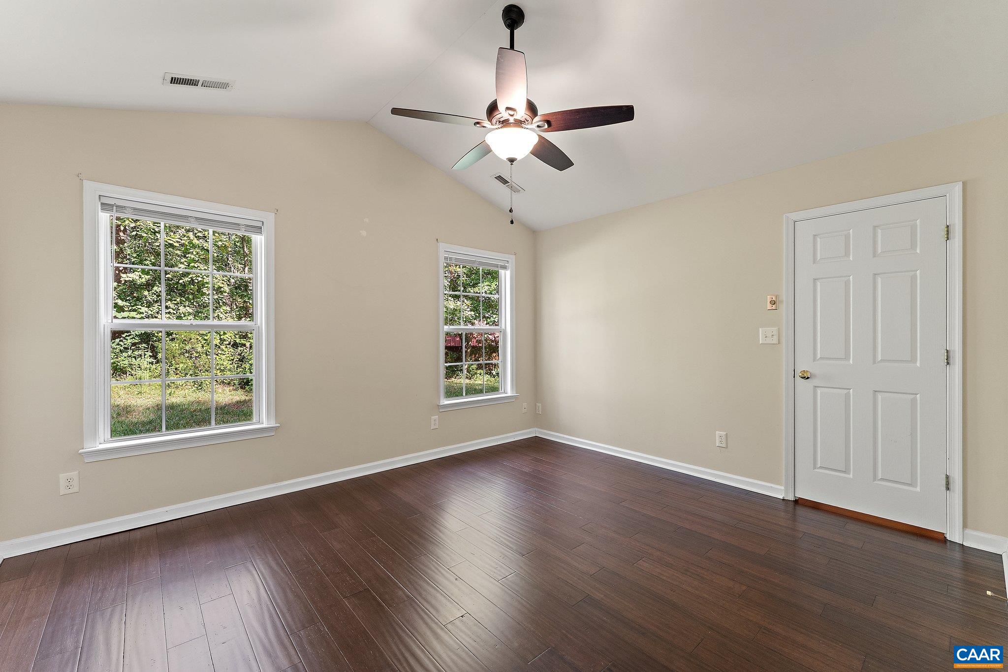 507 Northridge Road Ruckersville, VA 22968 - Photo 34 of 48 a view of an empty room with wooden floor and a window