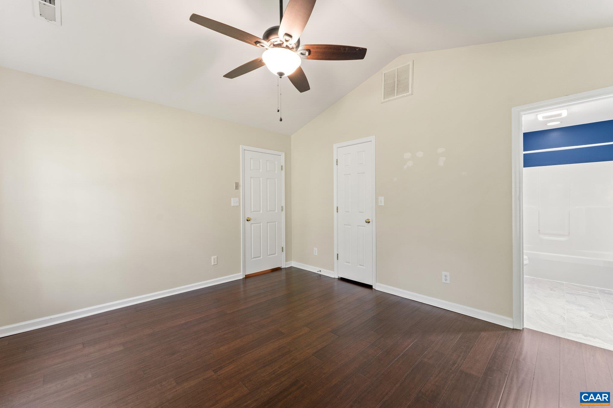 507 Northridge Road Ruckersville, VA 22968 - Photo 35 of 48 an empty room with wooden floor ceiling fan and window
