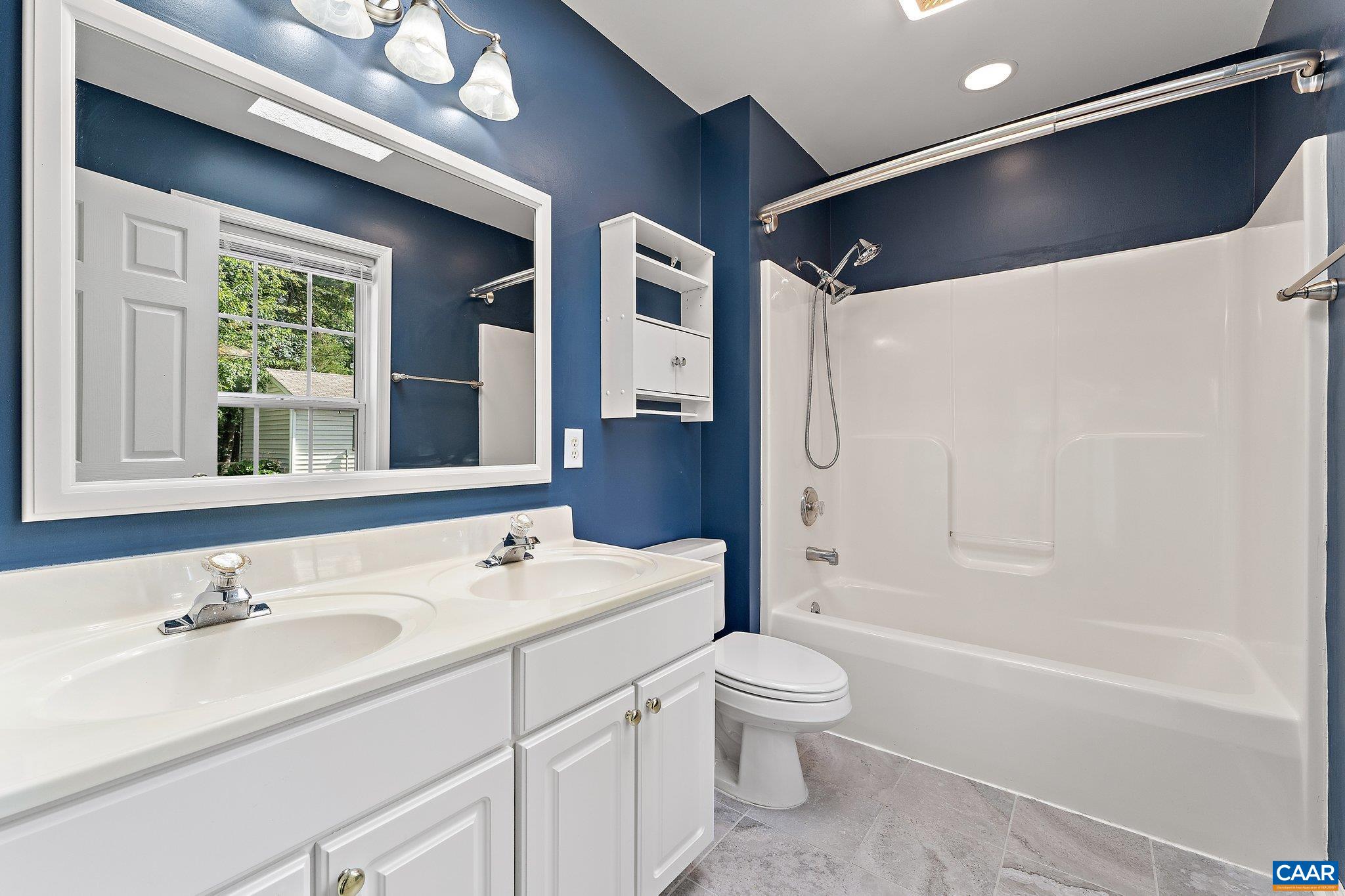 507 Northridge Road Ruckersville, VA 22968 - Photo 36 of 48 a bathroom with a sink a toilet and shower