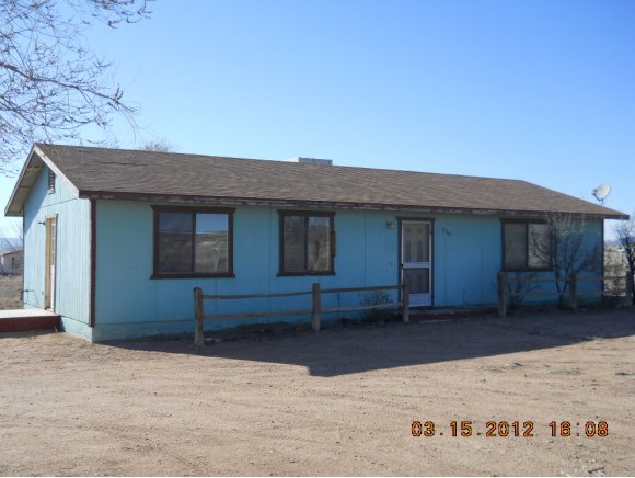 1350 West Antelope Run Road Paulden, AZ 86334 - Photo 1 of 11 a front view of a house with a yard