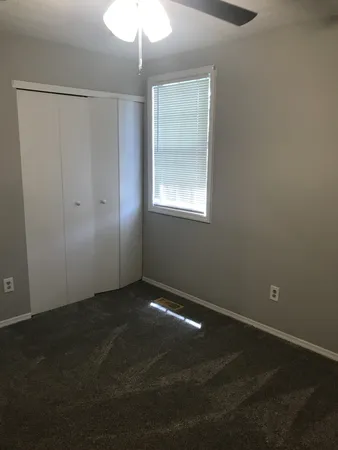 an empty room with a empty space and window