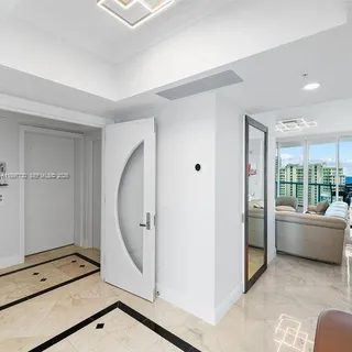 a spacious bedroom with a bed and a large window
